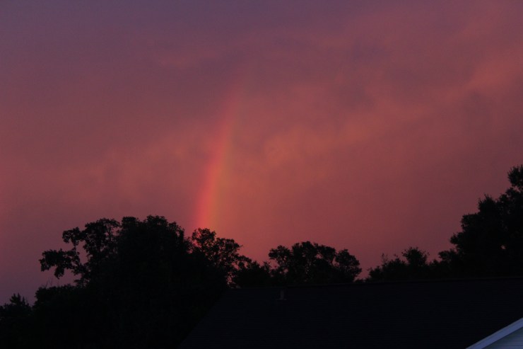 rainbow in a red evening sky